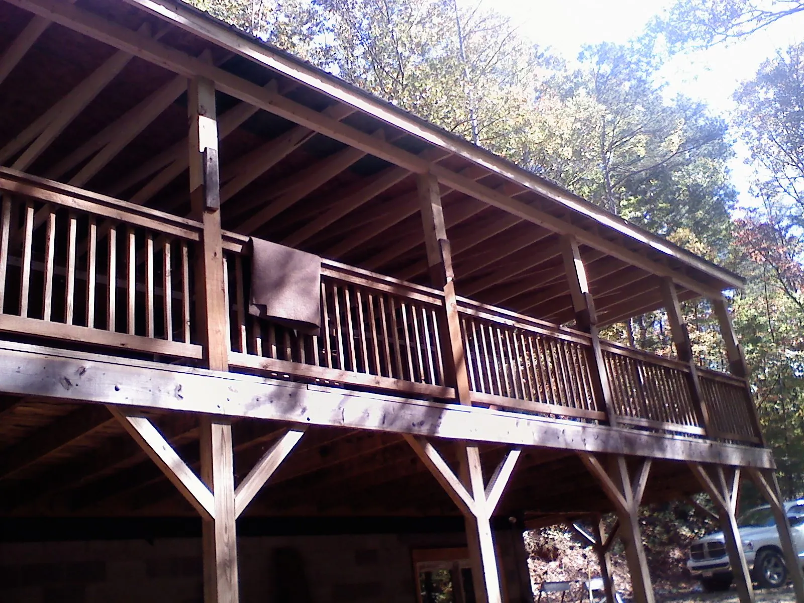 Timber framing under a new elevated porch and deck — Roof Leak Repair in Grants Pass by Roofing Brothers